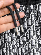 All‑Over Monogram Print Spliced Shorts
