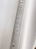 Side‑Embossed Letter Snap‑Detail Pants