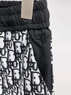 All‑Over Monogram Print Spliced Shorts