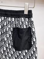 All‑Over Monogram Print Spliced Shorts