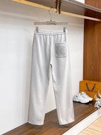 Side‑Embossed Letter Snap‑Detail Pants